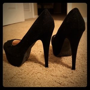 Black platform pumps